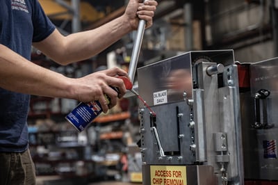 Cleaning a gutter machine as part of routine gutter machine maintenance