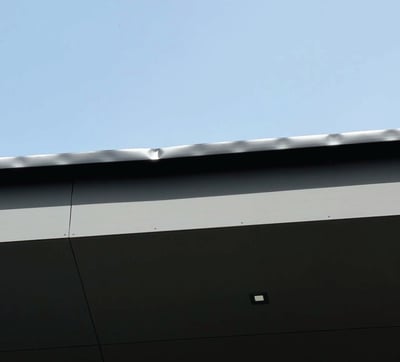 KWM Gutterman example of heat-related gutter expansion along a roof edge.